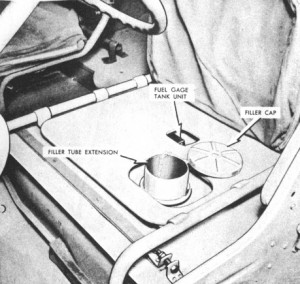 Why was the gas tank located under the driver's seat?