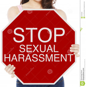 woman holding a conceptual stop sign on sexual harassment.