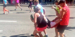 ... -down-gets-carried-across-the-finish-line-by-four-others-runners.jpg