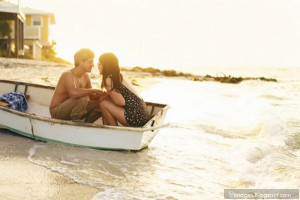 Sunset cute couple in boat girlfriend boyfriend beach