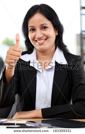 Confident young business woman with thumbs up gesture - stock photo HD ...
