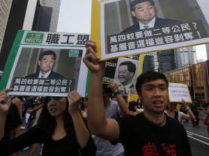 -democracy protesters carrying portraits of Hong Kong Chief Executive ...