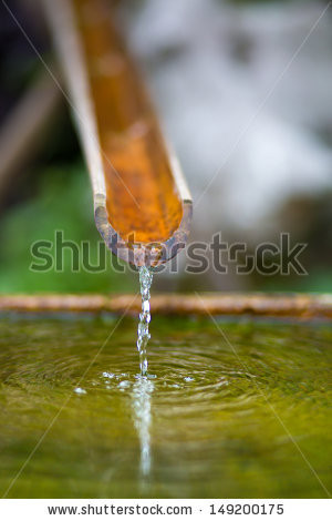 Traditional bamboo fountain with water in a temple in Hangzhou, China ...