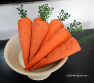 Fabric carrots. Clever! Might even fool a bunny or two.