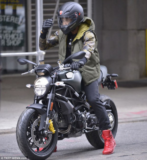 New toy: Usher took his purchase out for a spin, wearing his ...