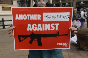 An American protesting the easy availability of military style weapons ...