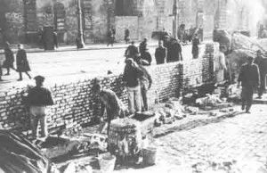 Warsaw ghetto wall under construction by Jewish forced laborers ...