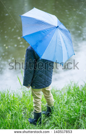 stock-photo-little-child-walking-in-the-rain-140517853.jpg