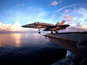 Military Plane Taking-Off From Aircraft Carrier