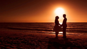 Romantic Couple on Beach during Sunset