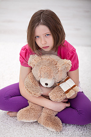 ... teddy portrait of sad little girl sad little girl holds a teddy