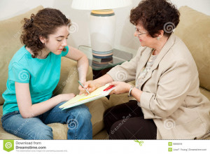 Psychologist giving a teen girl an agreement to sign before starting ...
