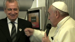 Pope Francis on the papal plane with his assistant