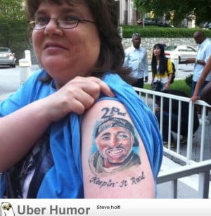 Tupac on her arm, Biggie fries and Biggie drink on her lap.