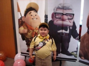 Great costume! It’s Russell, the kid from Up .