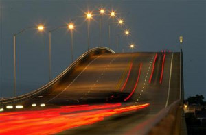 Taillights from vehicles are shown in a time exposure as motorists ...
