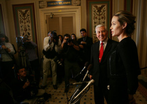 Angelina Jolie speaks to members of the press with Sen Richard Lugar