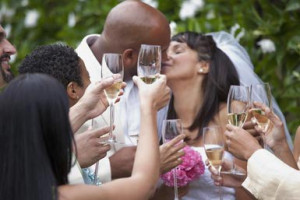 Guests toasting bride and groom on wedding day - Ariel Skelley/ Blend ...