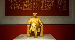 gold and jade statue of Mao Zedong is displayed at an exhibition in ...