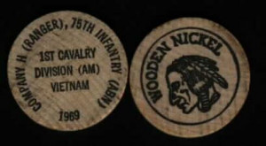 Both sides of our calling card wooden nickels