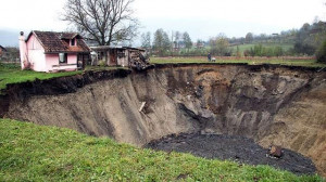 Sanica, Bosnia - Nov 2013. Village pond swallowed by sinkhole.