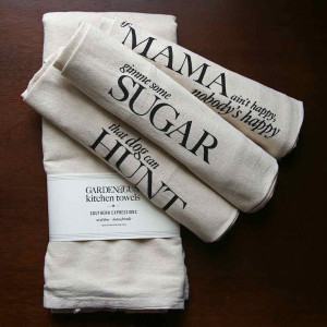 These charming kitchen towels bear endearing sayings indicative of ...