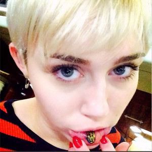 Miley Cyrus shows off her inner lip tattoo of a sad kitty in Instagram ...