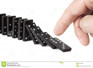 Royalty Free Stock Photos: Toppling a row of domino pieces