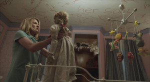 Mia (Annabelle Wallis) holds the Annabelle doll after threatening ...
