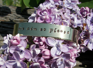 Grey Quotes We Aim To Please We aim to please hand stamped cuff quote ...