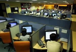File photo of people working at a call centre in Bangalore, March 17 ...