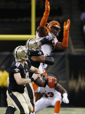 The Cincinnati Bengals defensive end Carlos Dunlap (96) gets up high ...