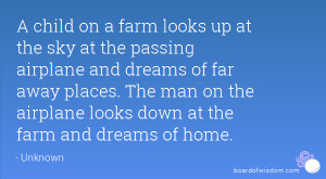 child on a farm looks up at the sky at the passing airplane and ...