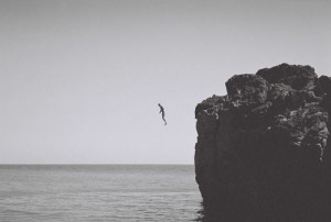 black and white, jump, ocean, person, photography, rocks, sea, water