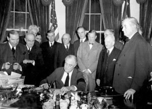 President Roosevelt signs the declaration of war following the ...