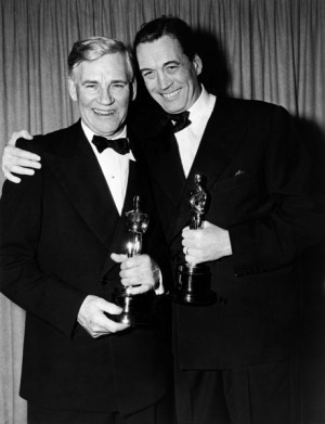 Walter and John Huston holding their Oscars.
