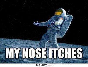 An Astronaut With An Itchy Nose