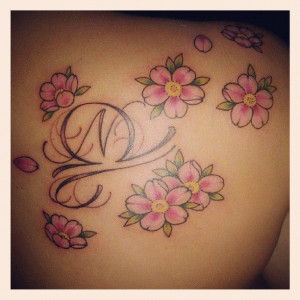 My beautiful cherry blossom tattoo with the libra sign in the middle ...