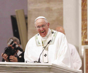 Francis lets out a hearty laugh during his homily at the first Mass ...