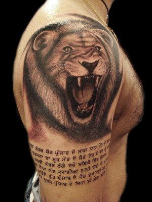 Lion whit punjabi writing tattoo by Miguel Angel tattoo