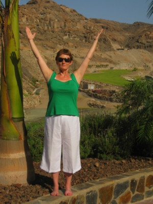 Photo of Anne with arms raised