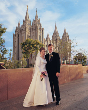 photo of a couple standing in front of the Salt Lake City Temple ...