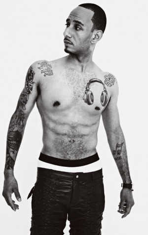 Swizz Beats' headphones plus nipple almost look like an animated face