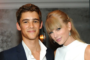 Taylor Swift and Brenton Thwaites on the set of The Giver