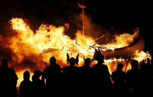 Flames engulf a viking longboat as it is set on fire during the Up ...