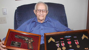 Robert Fritz holds a replica