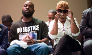 Image: Michael Brown's family listens during a rally convened in ...