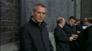 Paul Newman waits for his opportunity to escape while guards ...