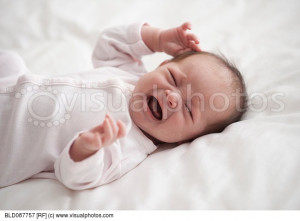 Crying Hispanic newborn baby girl