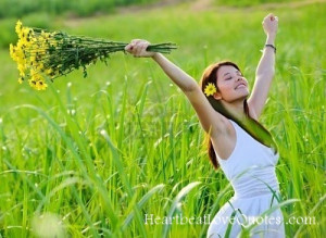carefree-adorable-girl-with-arms-out-in-field-summer-freedom-andjoy